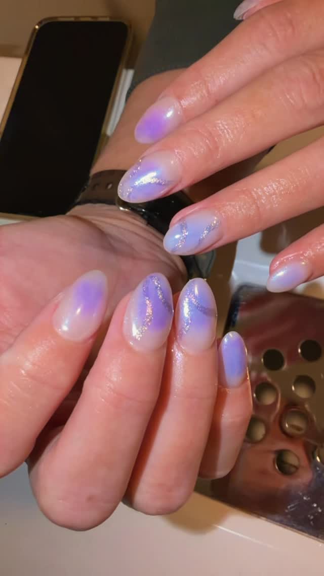 Soft lavender aura nails with glitter detail on almond tips by Nails By Rajvir